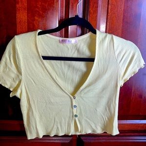 For women:Yellow button up crop top